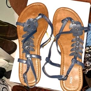 A pair of blue flowered thongs